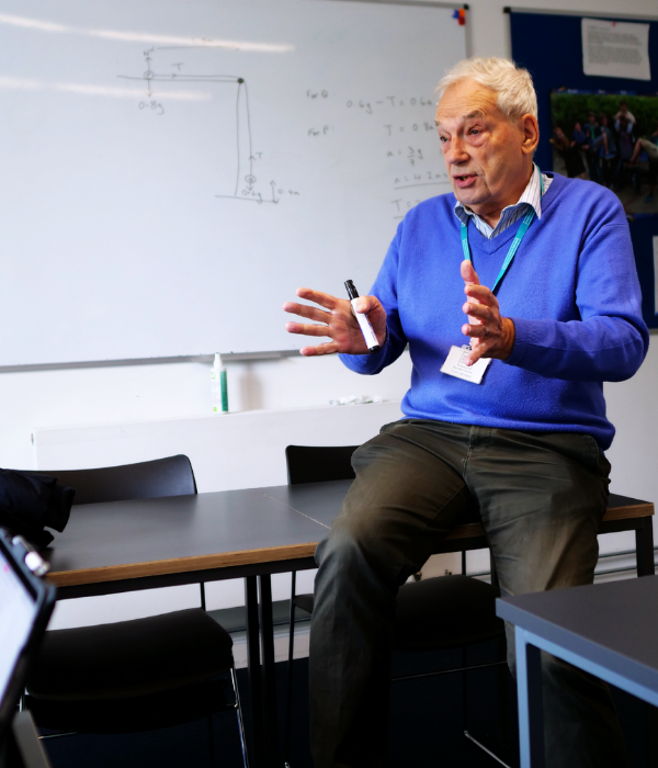 Maths Tutor addressing the class