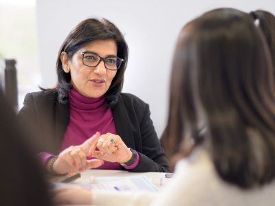 Tutor engaging with students in small class